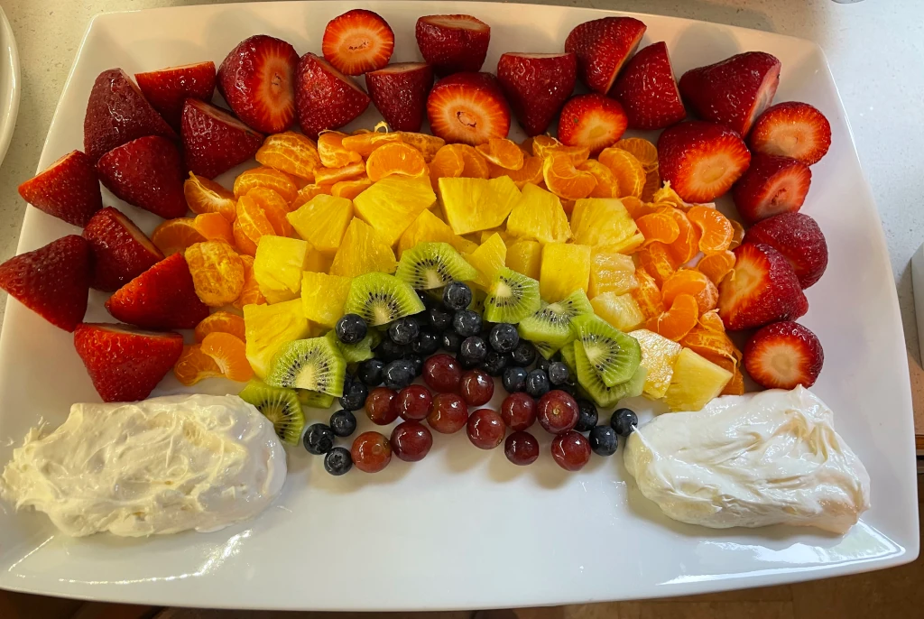 A fruit tray shaped like a rainbow