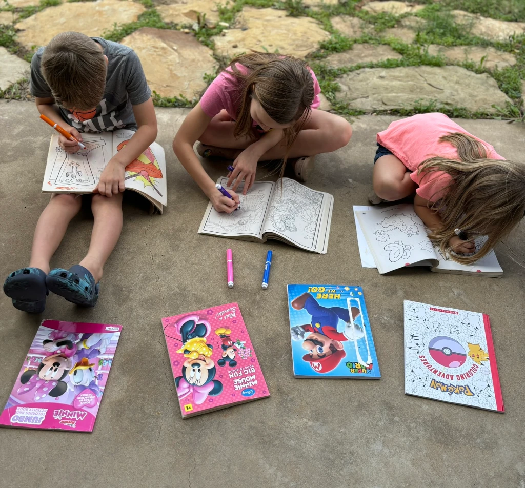 Kids coloring in coloring books