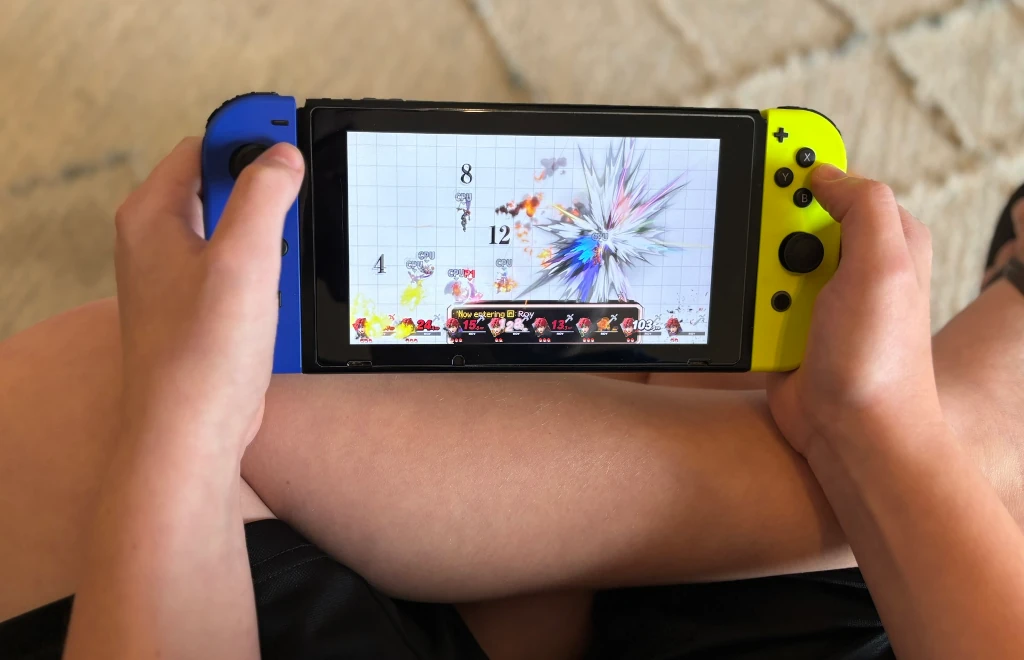 A boy playing on a Nintendo Switch