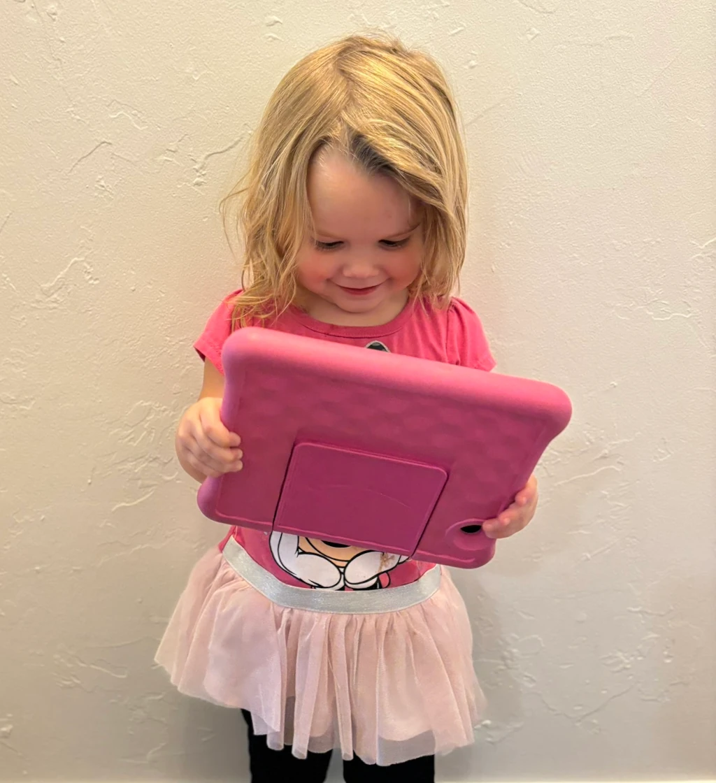 A girl holding a tablet