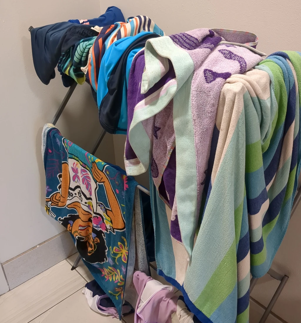 A drying rack covered in towels