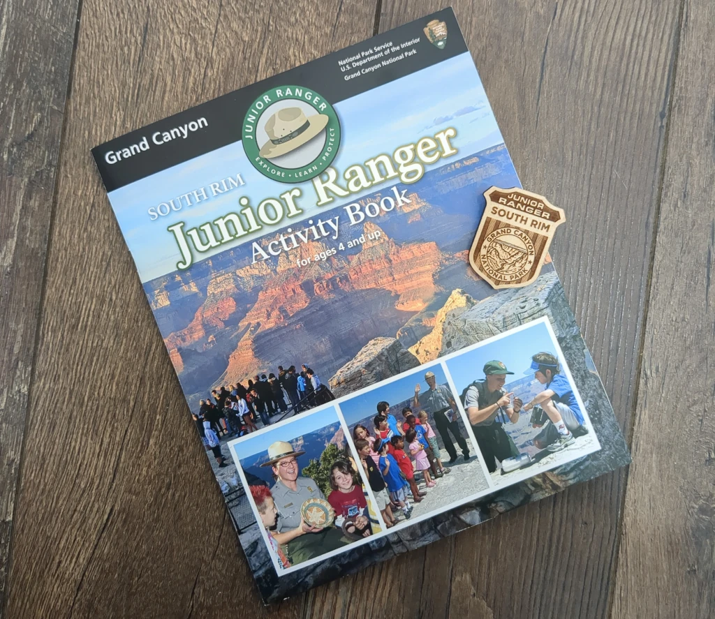 A booklet and badge for the National Park's Junior Ranger program