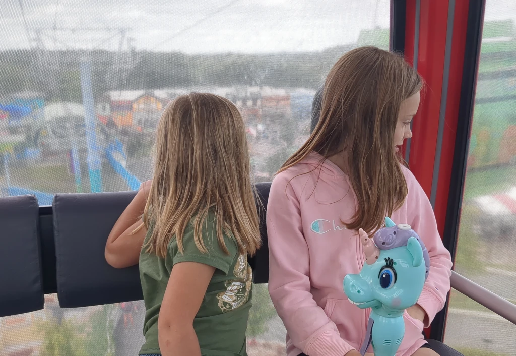 Two kids riding the Legoland Minifigure Skyliner ride