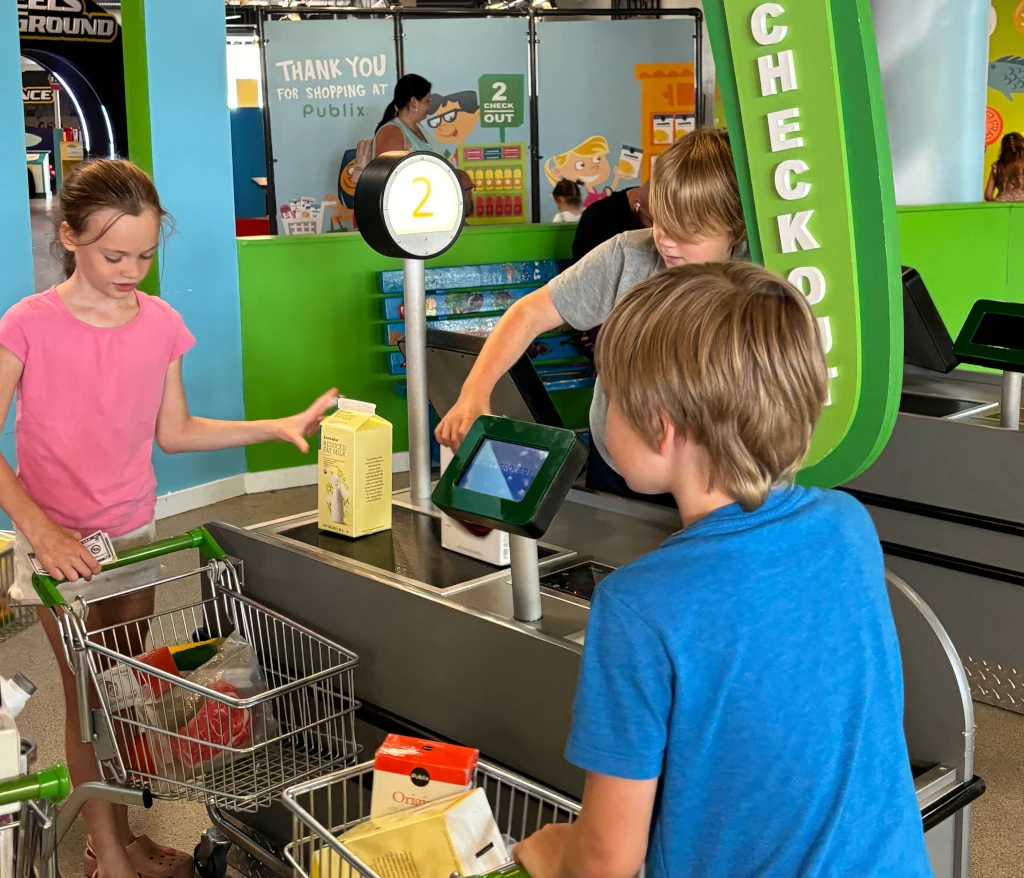 Kids playing at a pretend grocery store