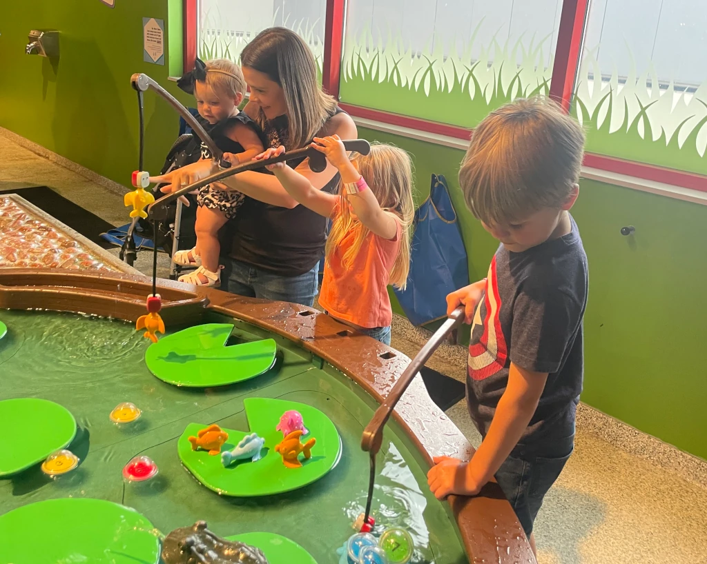 Kids playing at a water table