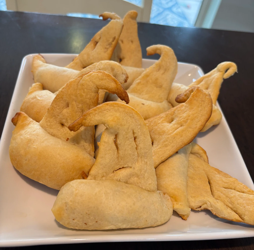 Pigs-in-a-blanket styled to look like wizard hats