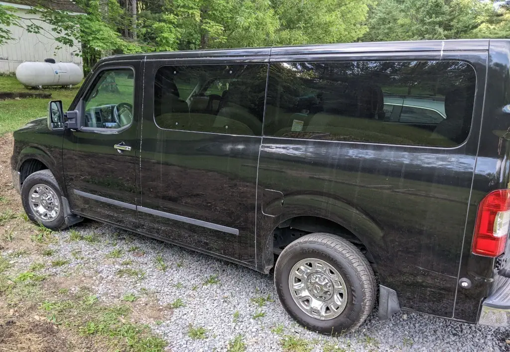 A black 12-passenger van