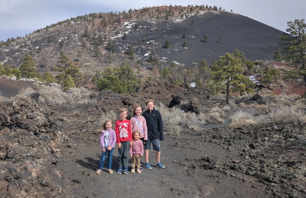 Kids posing in front of a mountain