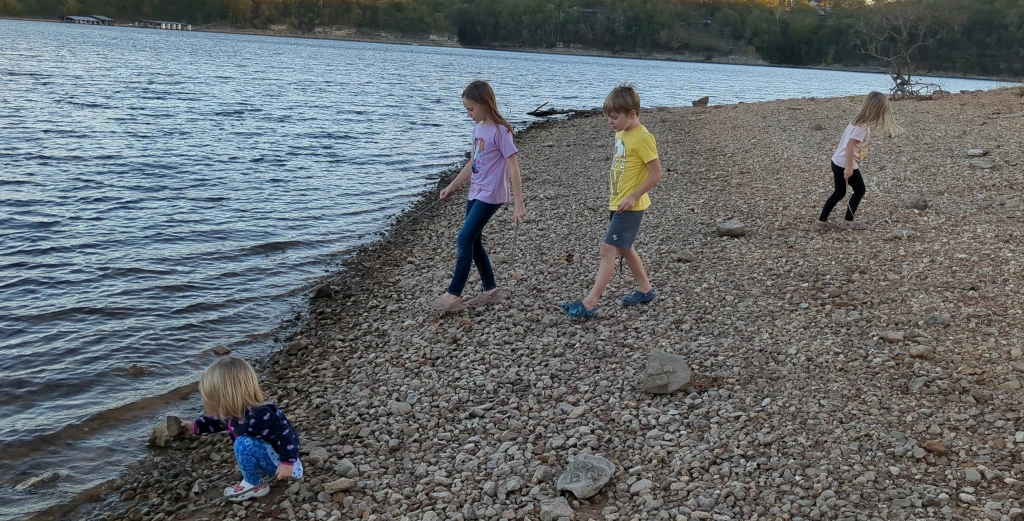 Kids playing by a lake