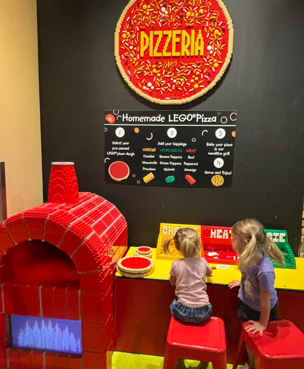 Two kids playing at the Legoland Discover Center pizzeria