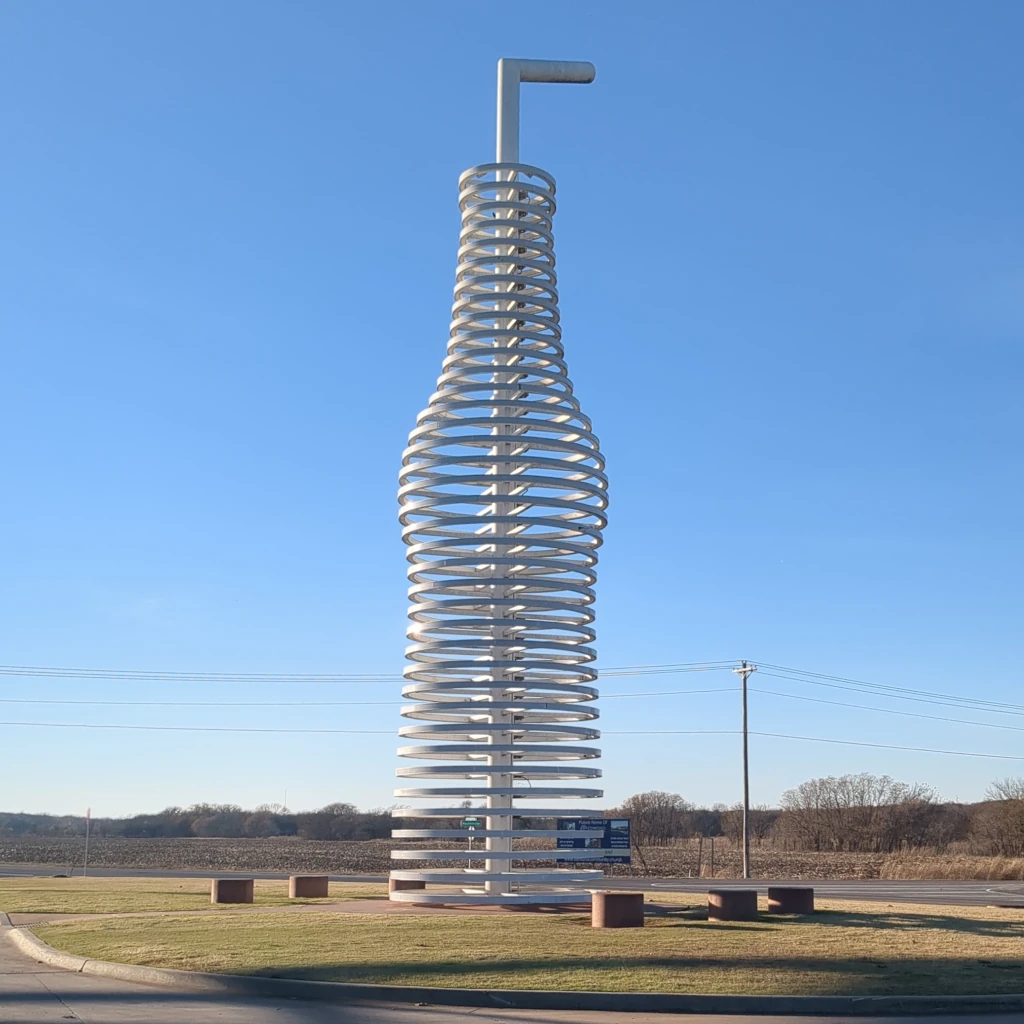 A statue of a soda bottle