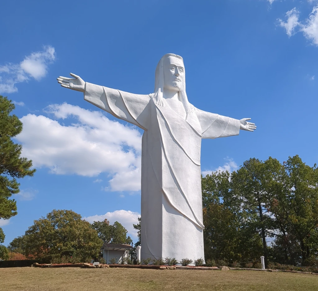 A large white statue of Jesus