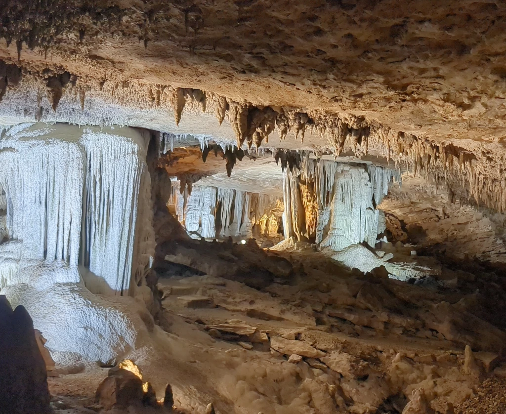 A cave with various rock formations