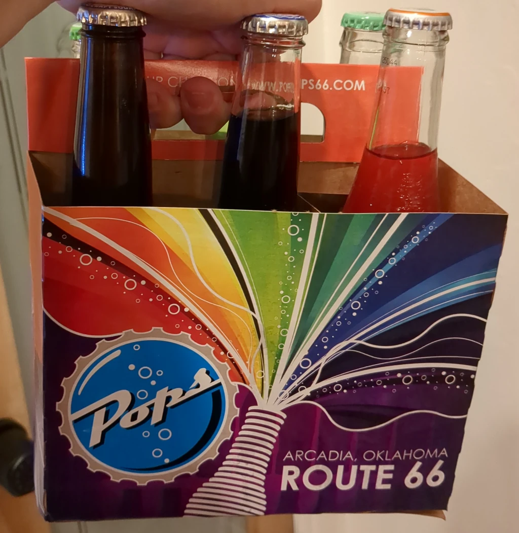 A six pack of soda that says 'Pops 66'