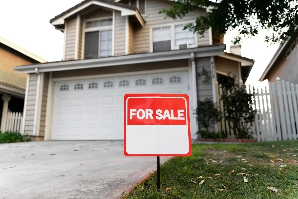 A house with a for sale sign